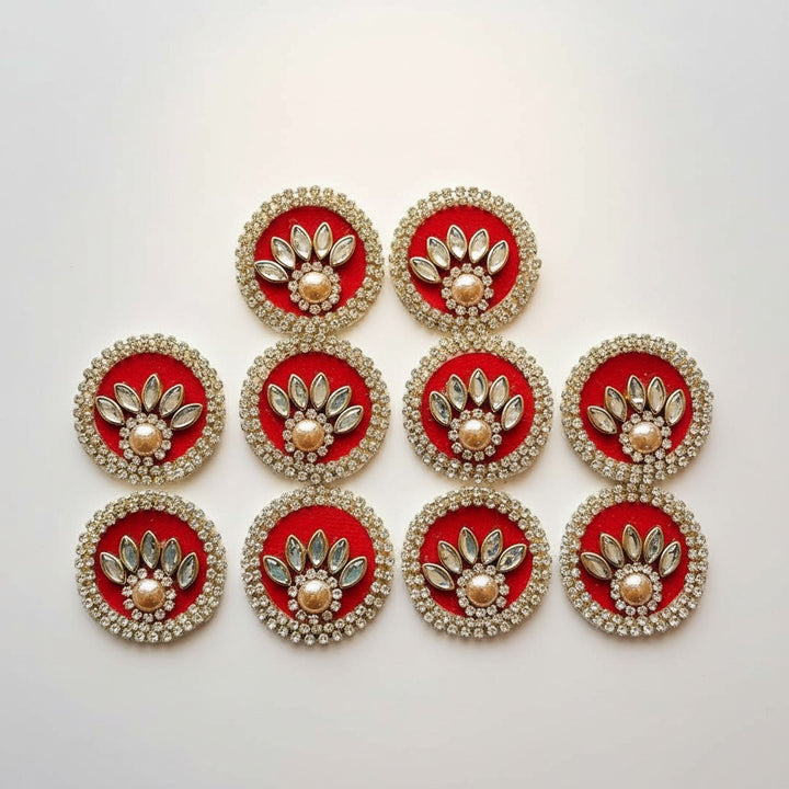 Adikala pack of 10 red round rhinestone patches with gold center, ideal for Laddu Gopal dresses and crafts.